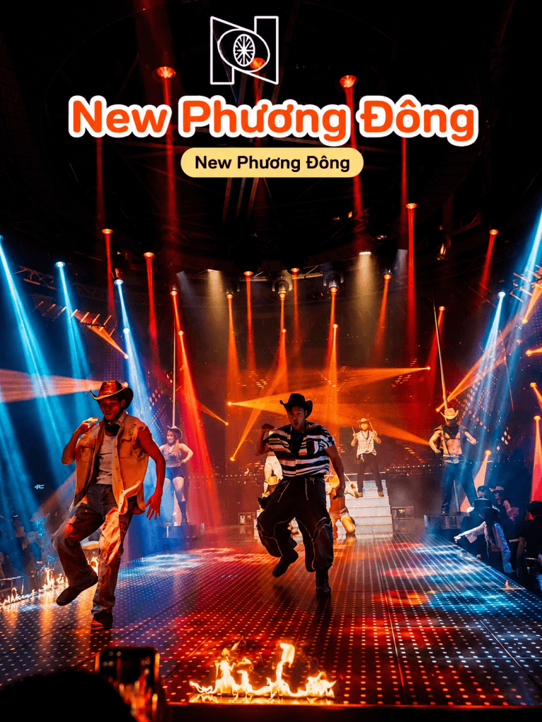 Dancers performing on stage with fire and red lights at New Phuong Dong Club in Da Nang