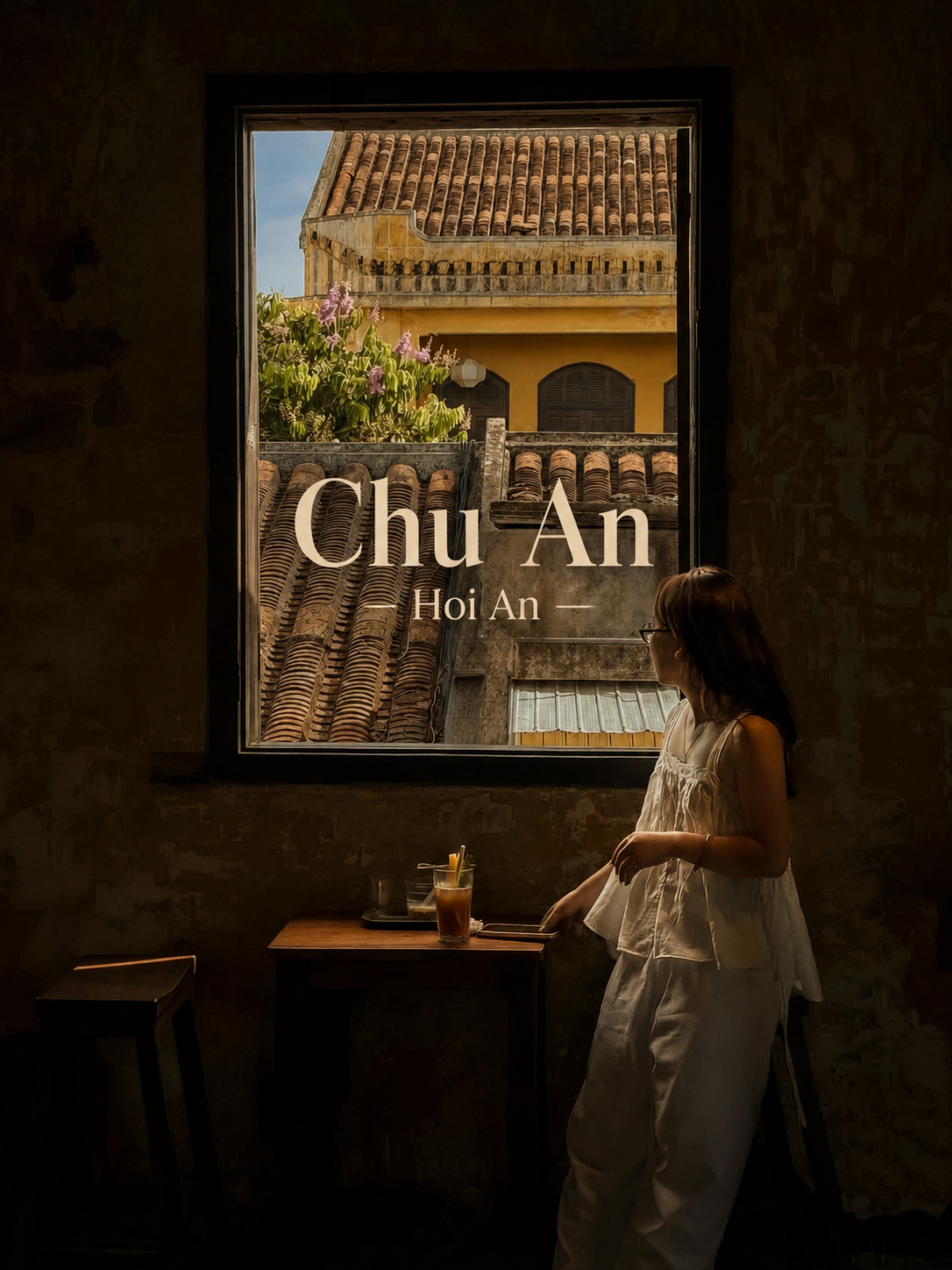 Chu An cafe in Hoi An, a dim vintage room with a window overlooking old tiled rooftops