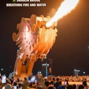 The Dragon Bridge in Da Nang breathing fire at night as crowds watch and take photos