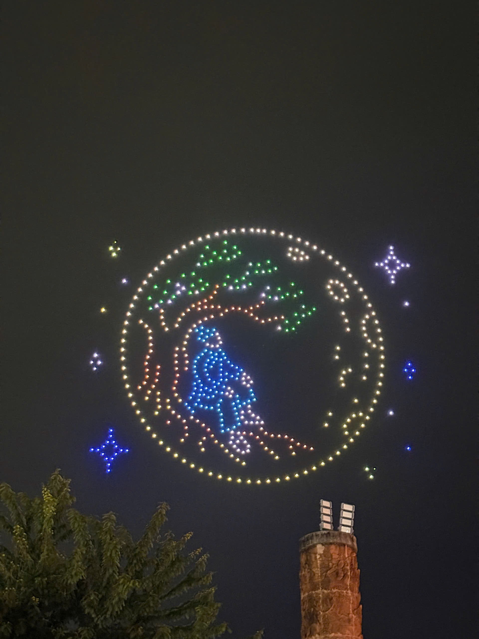 Drones forming a glowing circular Mid-Autumn scene in the night sky over Hoi An