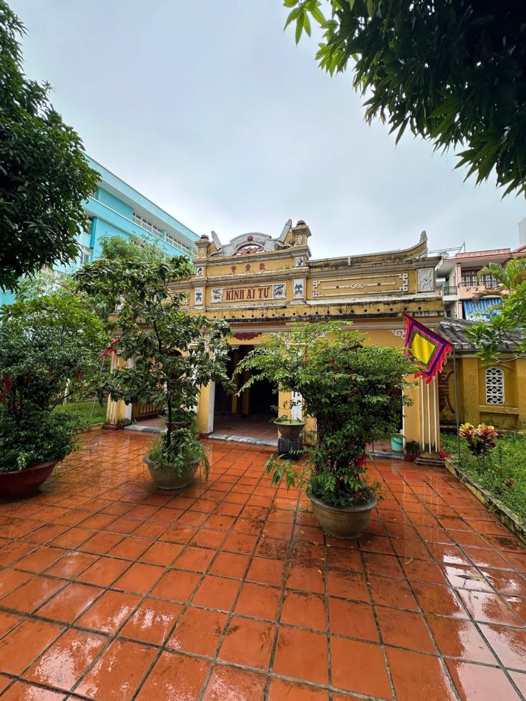 The tiled courtyard in front of the Kính Ái Tự shrine at Hải Châu Village Temple in Da Nang after the rain