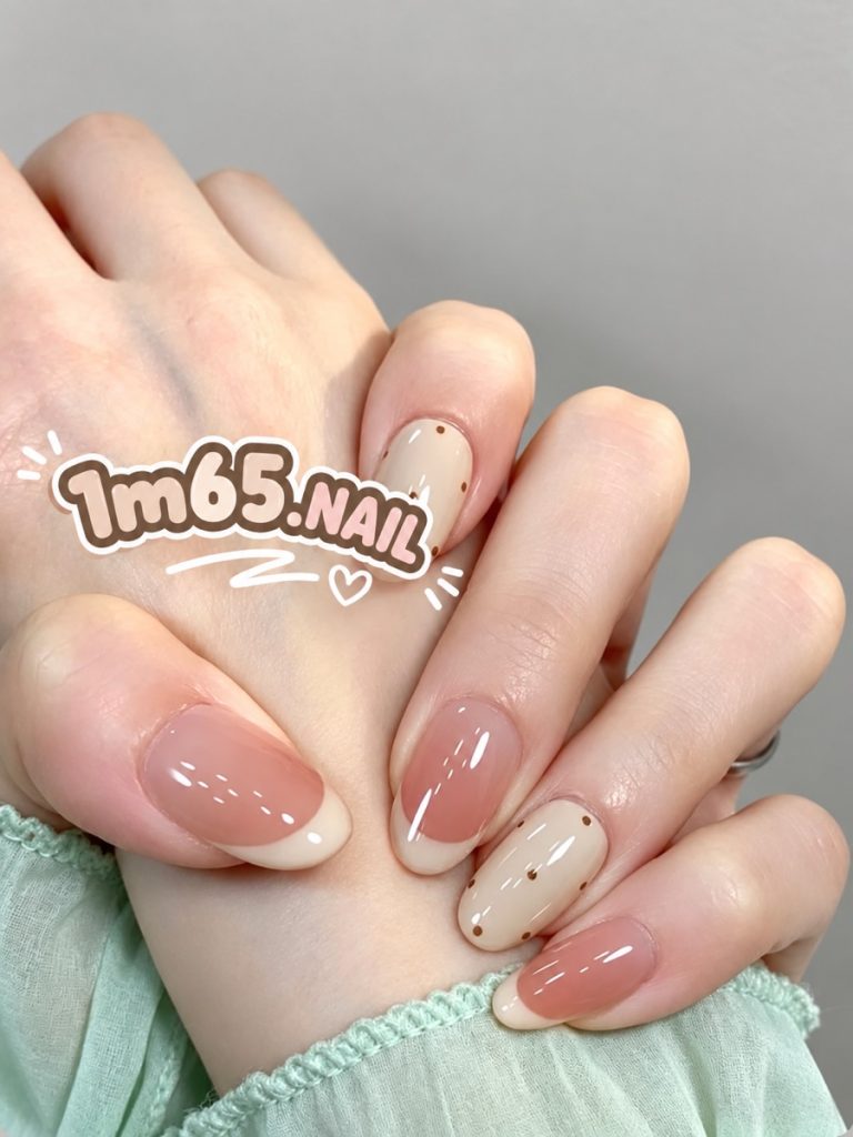 Soft nude almond nails with tiny dot details from 1m65.nail in Da Nang