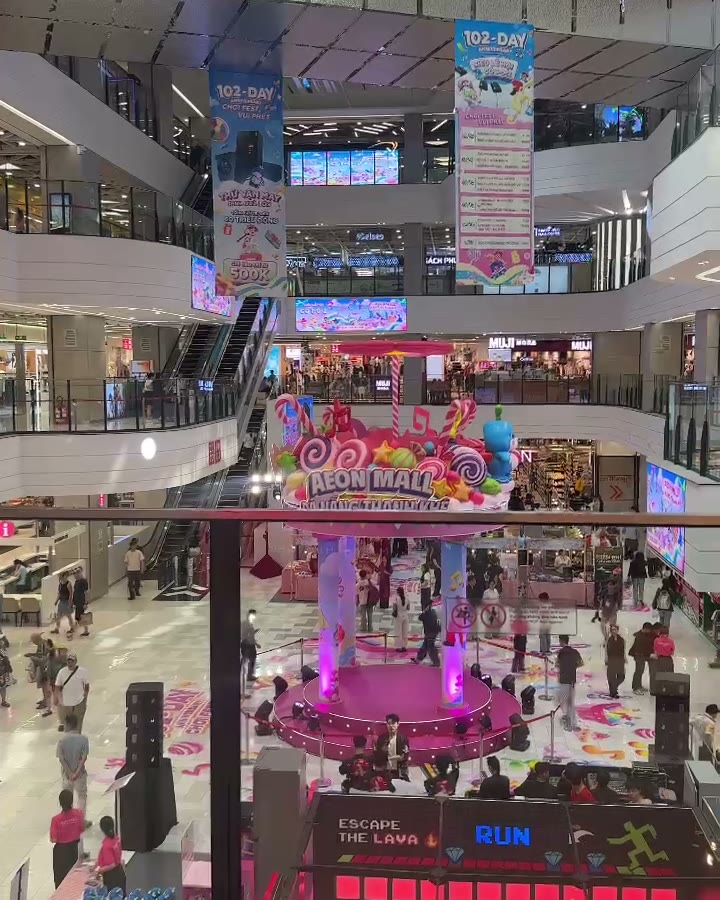 View down into the atrium of AEON Mall Da Nang Thanh Khe during the 102-day celebration, with the event stage and game zone