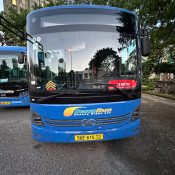 Front of a blue DanaBus electric city bus parked at a bus station in Da Nang