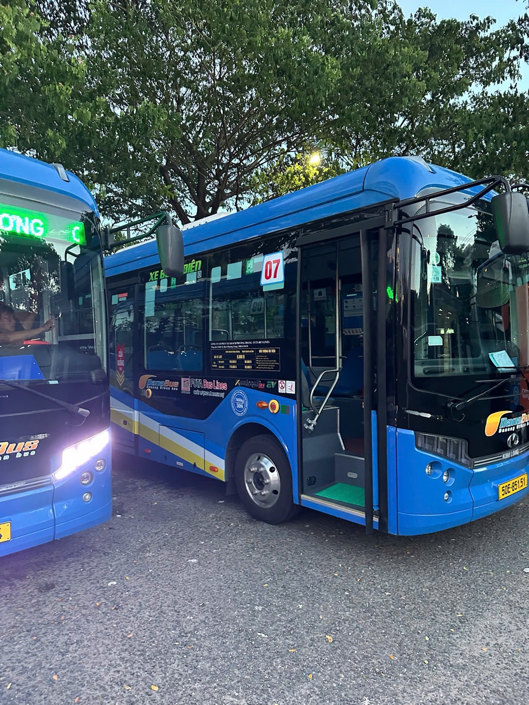 DanaBus route 07 electric bus with its front door open at a Da Nang bus station