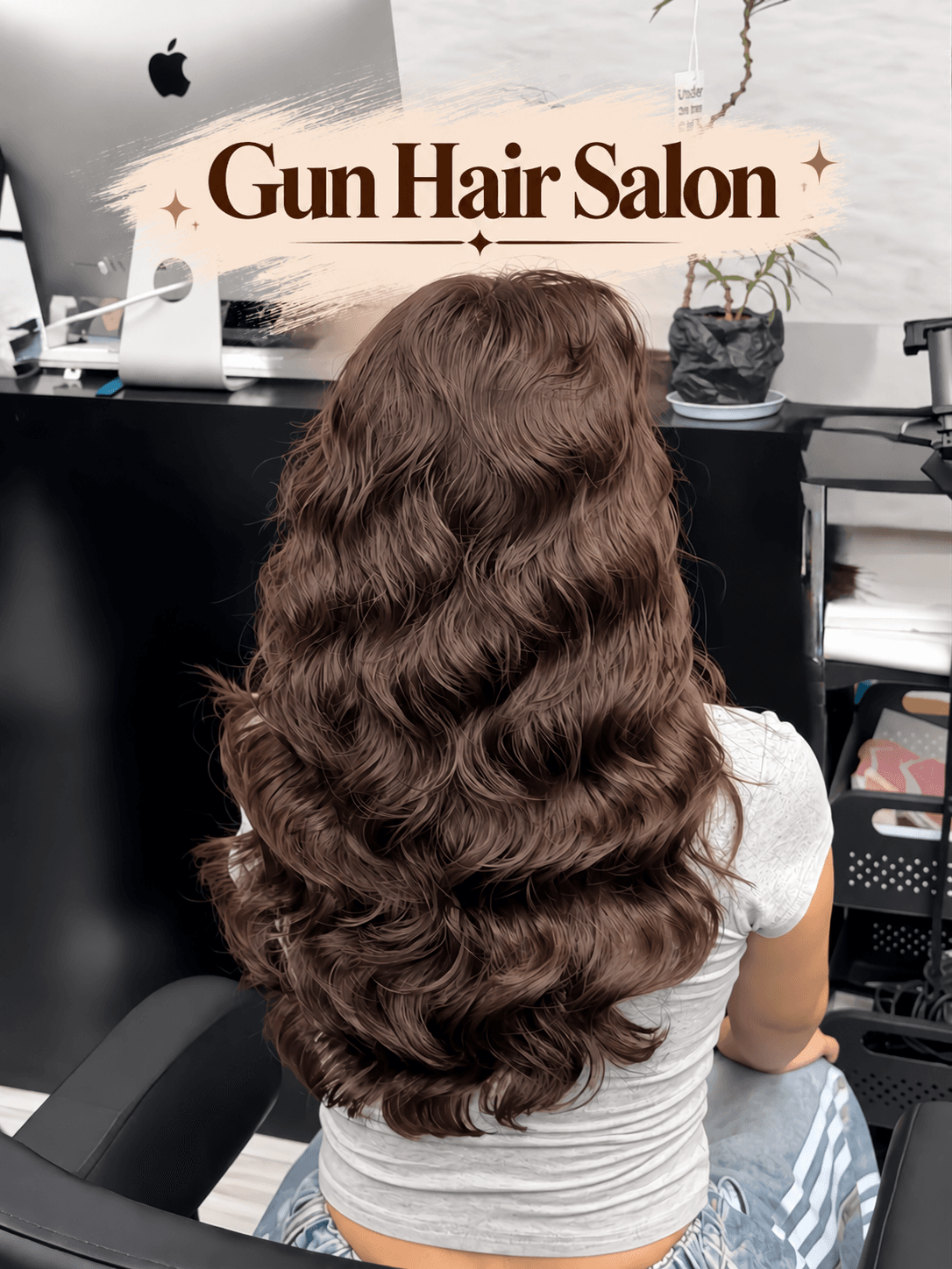 Long chocolate-brown hair styled in soft vintage waves at Gun Hair Salon in Da Nang