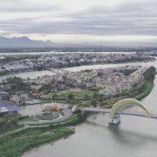 Aerial view of Hoi An Memories Land on its island in the Hoài River, with Hội An Old Town across the water