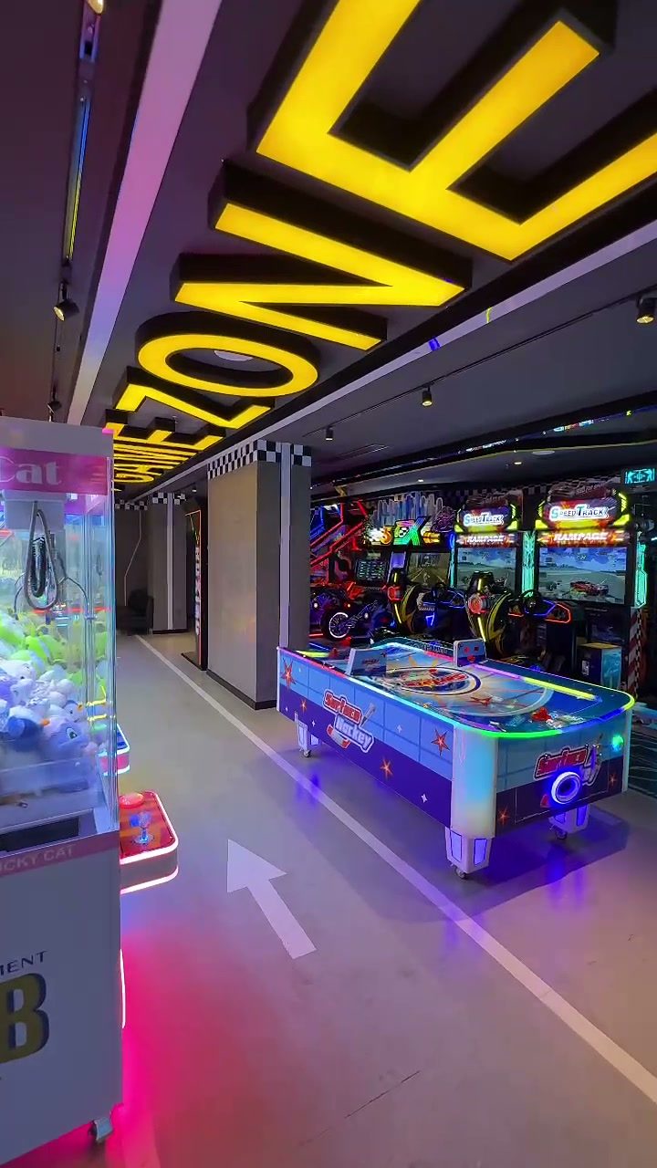 Game Zone arcade with air hockey tables and neon lights at Hoiana Resort & Golf