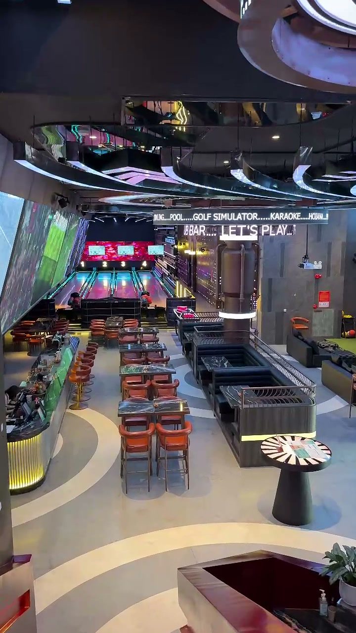 Sport Bar with large screens, bar seating and karaoke area at Hoiana Resort & Golf