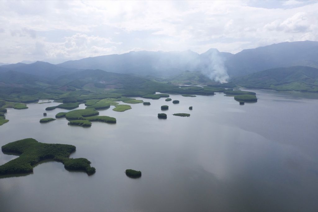 Aerial view of Khe Tân Lake in Da Nang with small green islands and mountains
