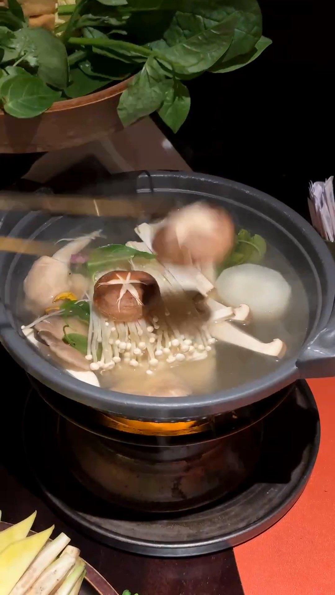 Mushroom hotpot simmering at Maha Vegetariano vegan restaurant in Da Nang