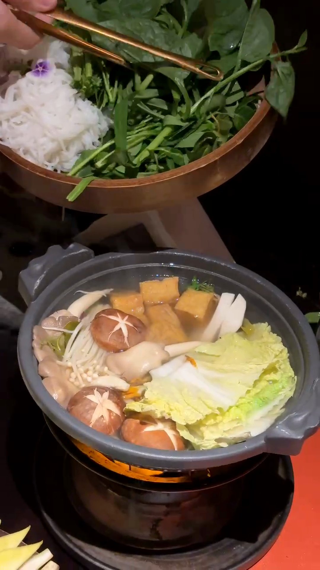 Lẩu nấm lá giang sour-leaf mushroom hotpot with fresh greens at Maha Vegetariano