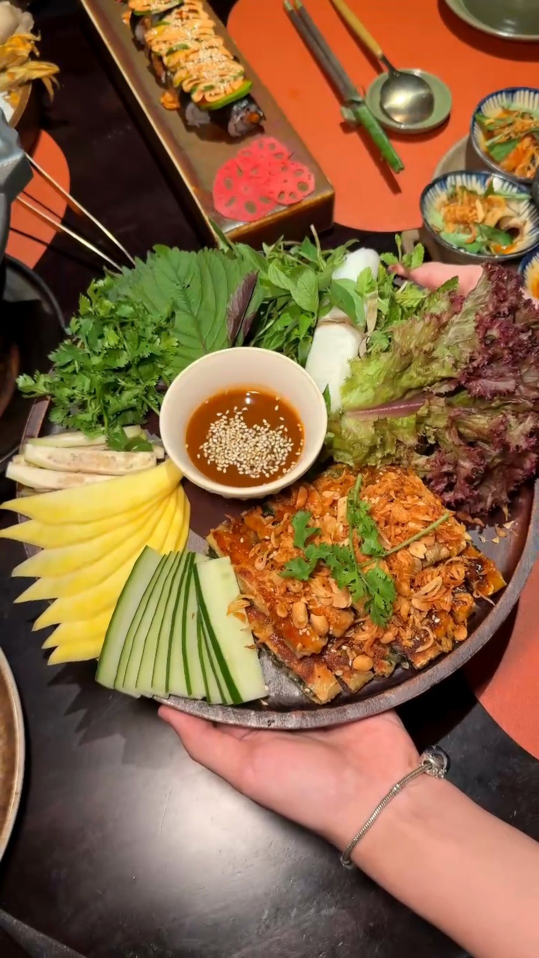 Mẹt cuốn nhân duyên platter at Maha Vegetariano: crispy rice-paper rolls with fresh herbs, mango, cucumber and sesame dipping sauce