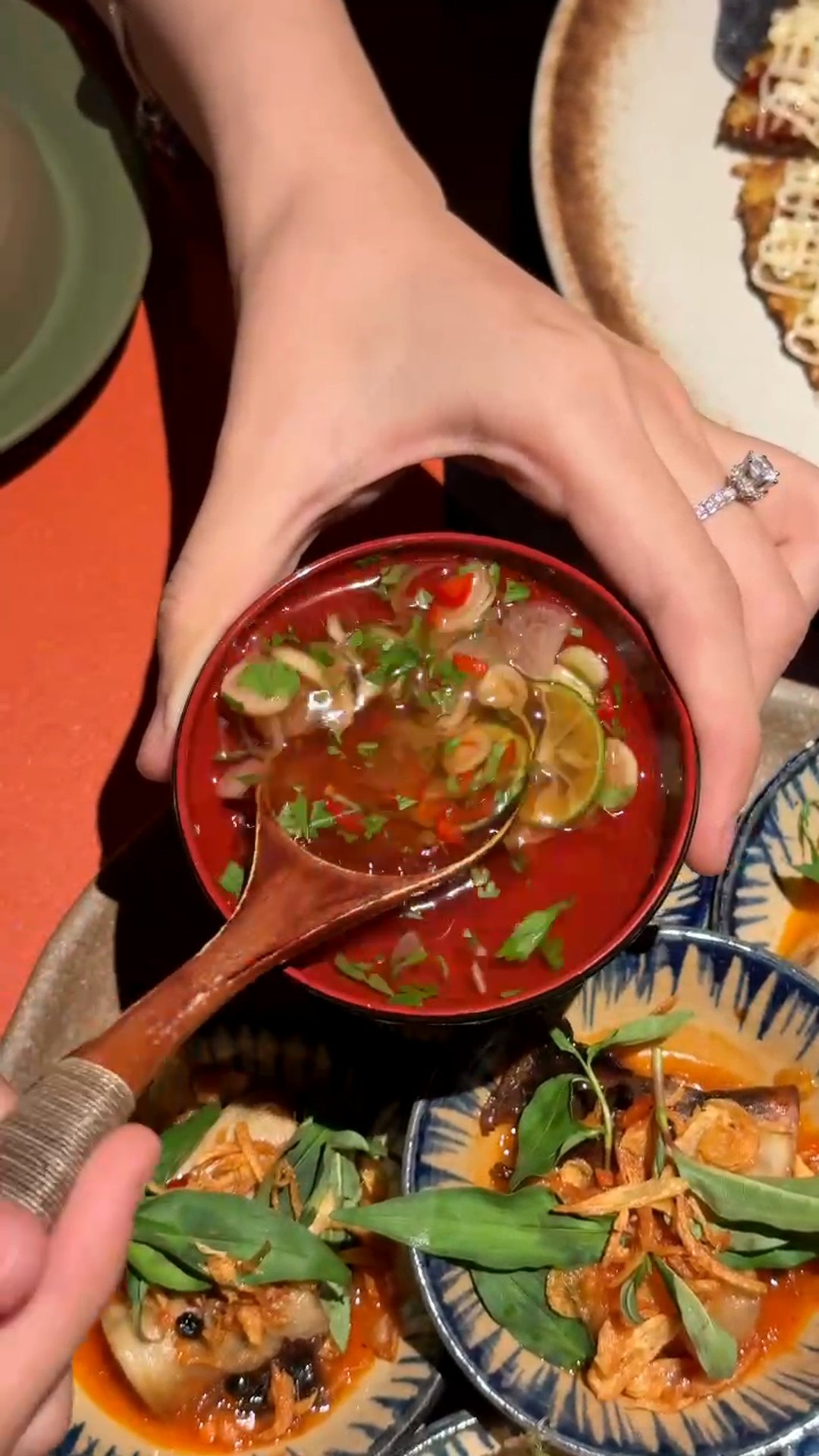 Nấm nướng tiêu chanh: six small bowls of grilled mushrooms with lime, pepper and fresh herbs at Maha Vegetariano Da Nang