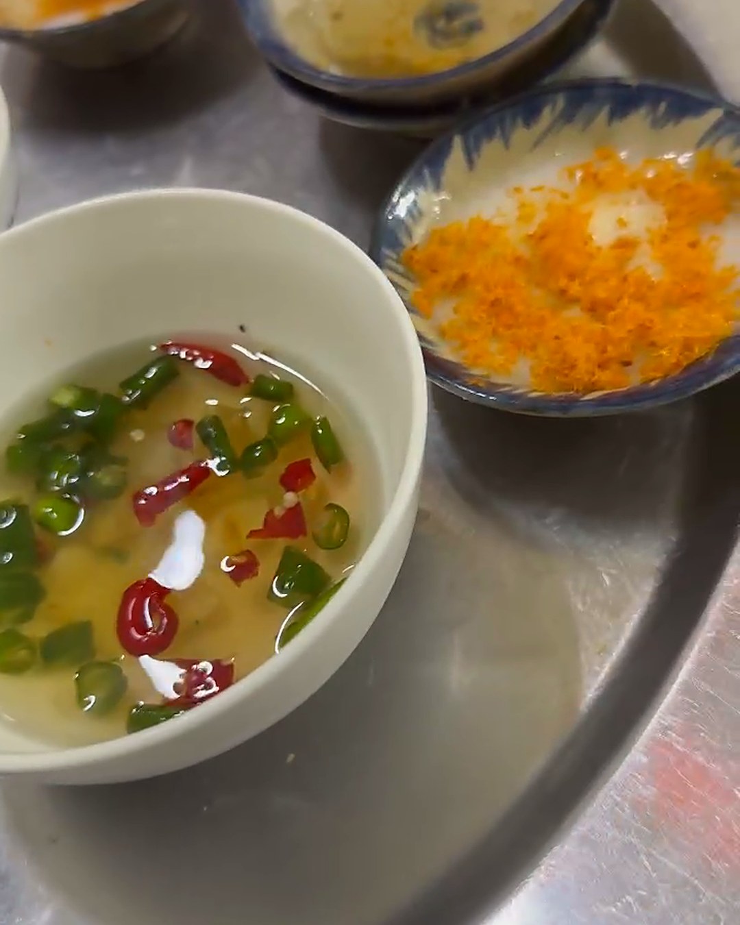 Bowl of mắm ớt tỏi, the spicy chili garlic fish sauce served with bánh bèo