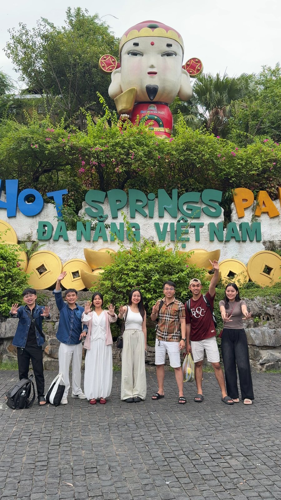 Entrance of Núi Thần Tài Hot Springs Park with the God of Fortune statue
