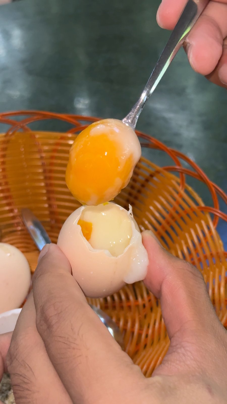 Soft-boiled hot spring egg with an orange yolk at Núi Thần Tài, Da Nang