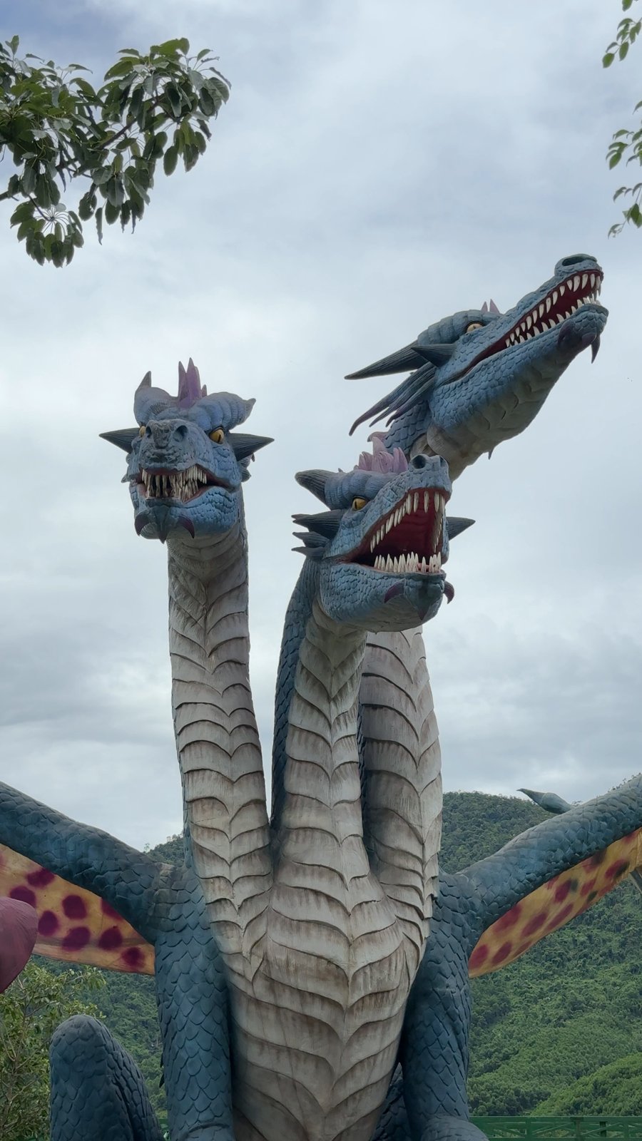 Giant dragon and dinosaur statues at Jura Park, Núi Thần Tài