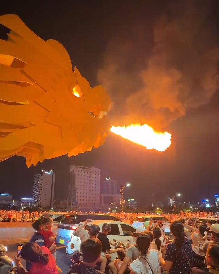 The Dragon Bridge breathing fire at night in Da Nang, a short walk from Son Tra Night Market