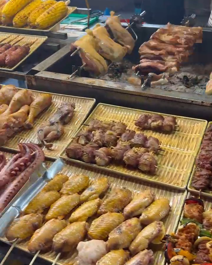 Grilled skewers and meats at a food stall in Son Tra Night Market