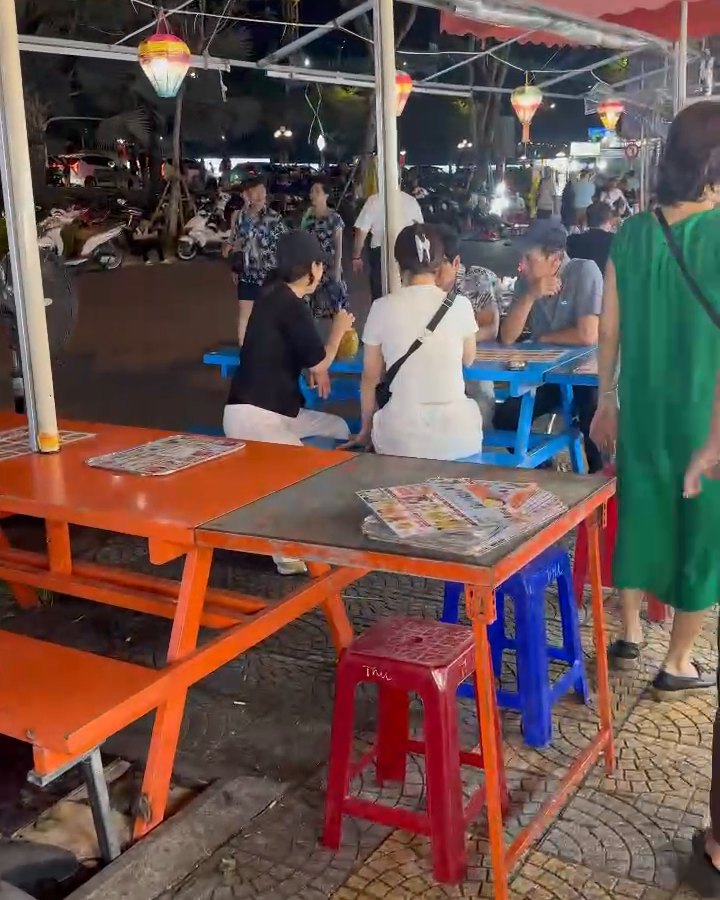 Tables and stools at the food area of Son Tra Night Market