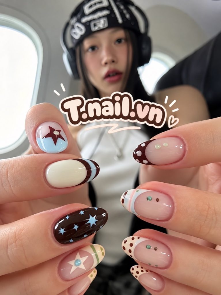 Playful nail art with stars, polka dots and stripes from T.nail.vn in Da Nang