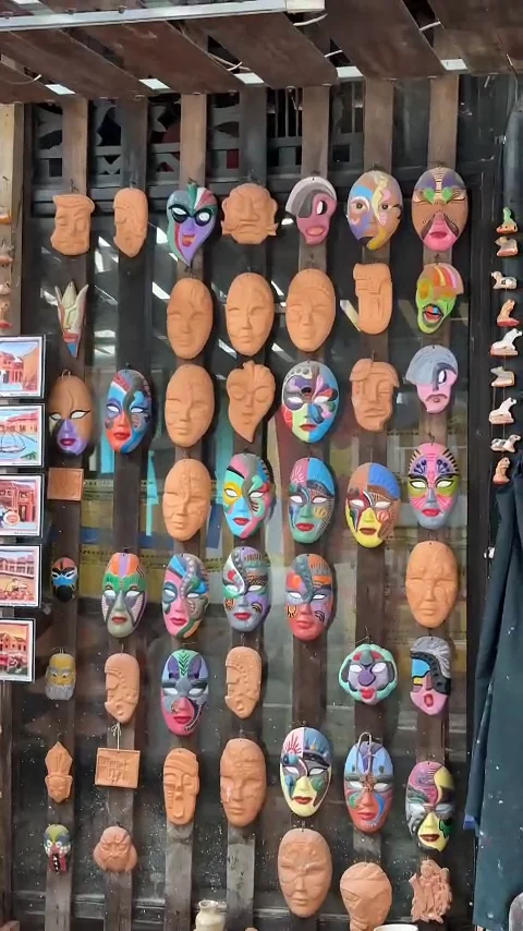 Wall of hand-painted terracotta masks for sale at Thanh Ha Pottery Village, Hoi An